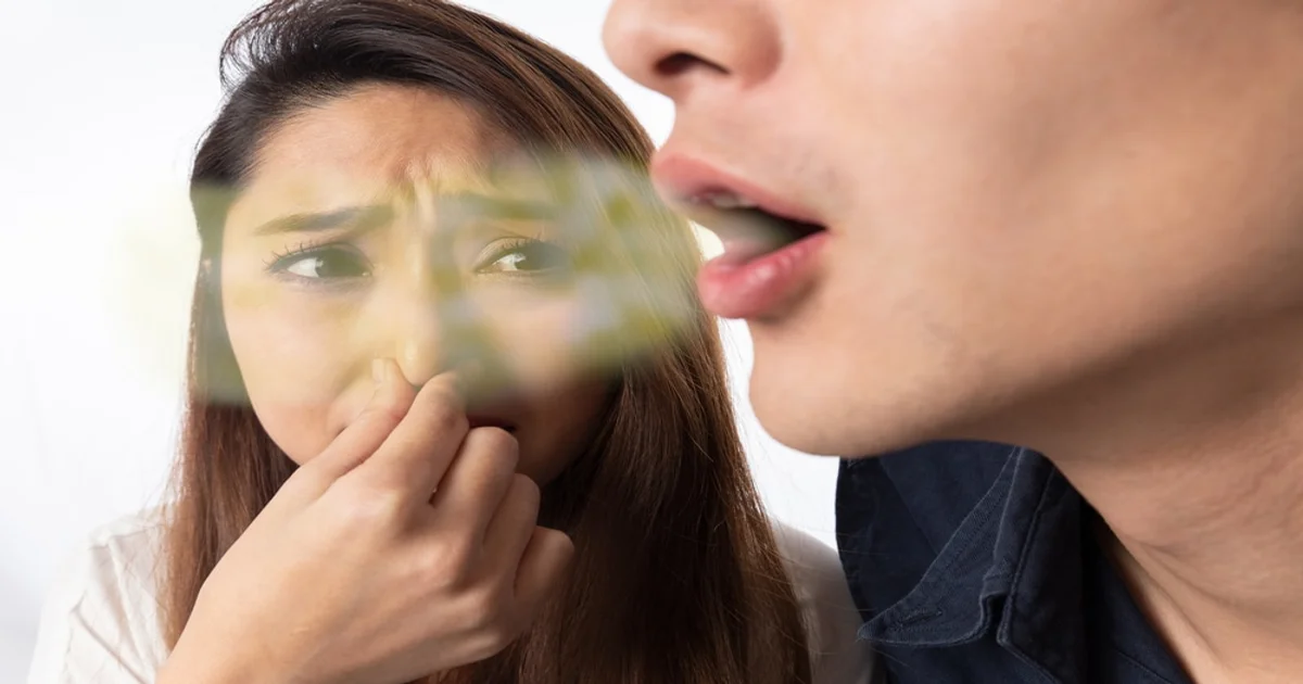 a picture of a woman suffering from other people's bad breath